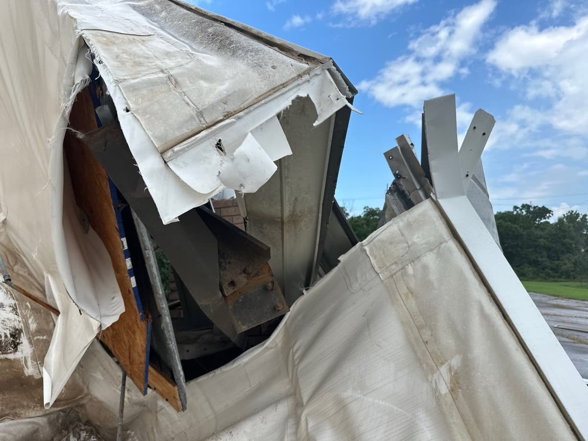 Tornado damage — torn apart metal commercial structure